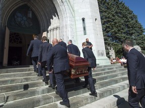 The casket bearing independent MNA Sylvie Roy is carried into the church for funeral services Monday, August 8, 2016 in Trois-Rivieres, Que.
