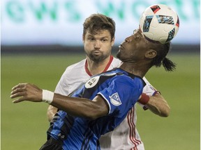 Toronto FC's Drew Moor (3) vies for the ball with Montreal Impact's Didier Drogba during first half MLS soccer action in Toronto on Saturday, August 27, 2016.