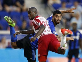 New York Red Bulls forward Bradley Wright-Phillips (99) and Montreal Impact defender Victor Cabrera (36) watch a header by Phillips goes in for a goal during the first half at Red Bull Arena on Aug. 13, 2016 in Harrison, NJ.