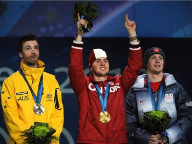Alexandre Bilodeau celebrates after receiving the Olympic gold medal in the Freestyle Skiing-Men's Moguls event at the 2010 Winter Olympic Games in Vancouver. He finished ahead of Australia's reigning champion Dale Begg-Smith and American Bryon Wilson.