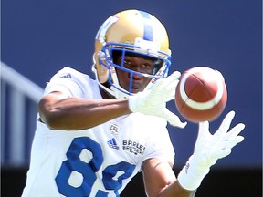 Winnipeg Blue Bombers wide receiver Clarence Denmark hauls in a pass during CFL football practice in Winnipeg.