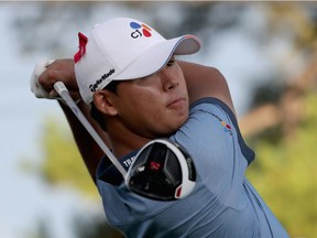 Si Woo Kim hits a tee shot on the 18th hole during the final round of the Wyndham Championship at Sedgefield Country Club on August 21, 2016, in Greensboro, North Carolina.