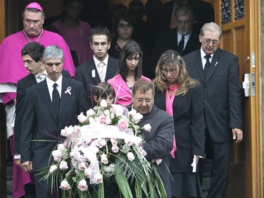 The family of Anastasia De Sousa, father Nelson (L), boyfriend Nick Debeyiotis (rear centre), brother Nicholas (front, centre partially hidden), sister Sarah (rear right) and mother Louise follow her casket after the funeral service for Anastasia, Sept. 19, 2006, at the Our Lady of Czestochowa Church on Hochelaga St. in Montreal.