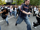 Bystanders flee Westmount Square, Sept. 13, 2006, after false reports that there was a second shooter in the mall. Among them were Dawson College students who were on the street having fled the shooting rampage in the school.