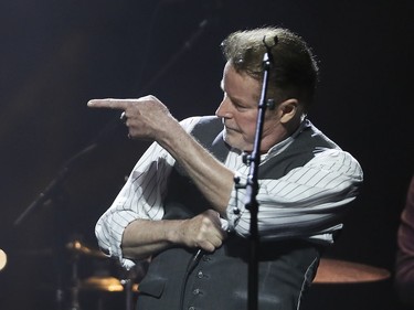 Don Henley gestures to a band member while in performance at the Bell Centre in Montreal on Wednesday, Sept. 14, 2016.