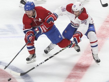Forward Brendan Gallagher (left) and defenseman Ryan Johnston battle for a puck during a Red vs. White scrimmage with Montreal Canadiens players at the Bell Centre in Montreal Sunday, September 25, 2016.