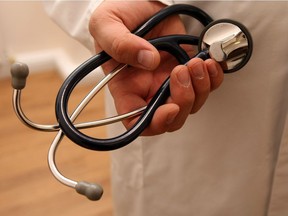 A doctor holding stethoscope.