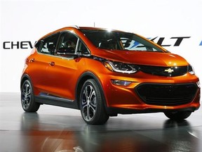 FILE - In this Monday, Jan. 11, 2016, file photo, the Chevrolet Bolt EV debuts at the North American International Auto Show in Detroit. The Chevrolet Bolt, General Motors‚Äô Tesla-fighting electric hatchback for the masses, will be able to go 238 miles on a single charge. The car beats the base rear-wheel-drive Tesla Model S, which can go 210 miles per charge but costs about $28,500 more. (AP Photo/Paul Sancya, File)