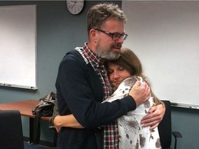 Kevin and Julie Garratt embrace at Vancouver airport following his return to Canada. (Garratt family photo) ORG XMIT: POS1609151728336265