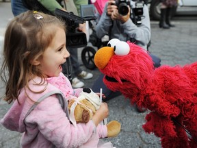 It was well and good for Leslie Carrara-Rudolph to interact with Sesame Street's Elmo in New York in 2009, but "you can't hone important skills like making eye contact or social interactions if you spend too much time watching TV," says Université de Montréal professor Linda Pagani.