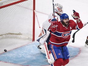 Montreal Canadiens' Alexander Radulov, from Russia, celebrates after scoring the first goal against Washington Capitals goaltender Vitek Vanecek, from the Czech Republic, during first period NHL pre-season hockey action Tuesday, September 27, 2016 in Montreal.