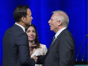PQ leadership candidates Alexandre Cloutier, left, Jean-François Lisée and Marinte Ouellet at a debate Sunday. Tension between frontrunners Cloutier and Lisée has overshadowed several of the debates already, with Ouellet and Paul St-Pierre Plamondon struggling to get their messages across.