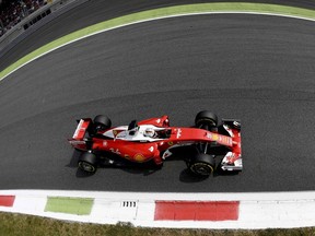 Sebastian Vettel steers his Ferrari during practice for the Italian Grand Prix in Monza.