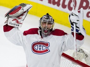 Montreal Canadiens goalie Charlie Lindgren celebrates following the team's 4-2 victory in an NHL hockey game against the Carolina Hurricanes in Raleigh, N.C. Thursday, April 7, 2016.