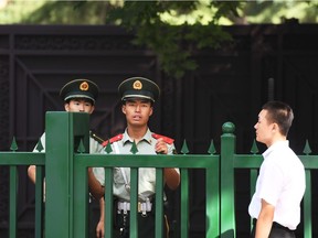 Chinese paramilitary policemen stand outside the entrance to the North Korean embassy in Beijing on September 9, 2016. North Korea appears to have conducted a fifth nuclear test on September 9, 2016. Authorities in Japan and South Korea said, after monitors detected a 5.3-magnitude "artificial earthquake" near its main nuclear site.