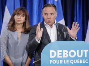 CAQ leader Francois Legault, right, and CAQ immigration critic Nathalie Roy, left, speak to the media in St-Jerome to announce their plan to reduce the number of immigrants to Quebec from 50,000 to 40,000 per year on Tuesday, August 30, 2016.