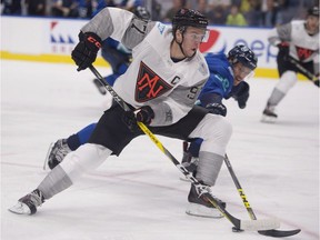 Team North America's Connor McDavid skates to the net as Team Europe's Roman Josi defends during first period of a pre-tournament game at the World Cup of Hockey, Thursday, September 8, 2016 in Quebec City.