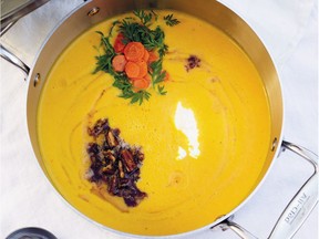 Carrot soup is topped with fresh carrots and pecans sautéed in browned butter. Credit: Rinne Allen, Clarkson Potter/Random House
