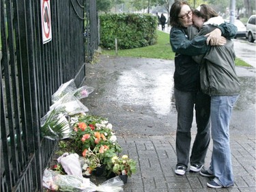 Dawson College student Carys Harding-Jones is comforted by her mother, Gaynor Harding, at the Sherbrooke St. entrance to the school, Sept.14, 2006, one day after the fatal shooting. Harding-Jones was inside the building when the shooting occurred.