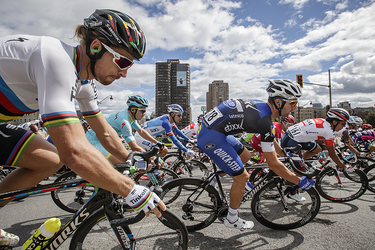 Peter Sagan of Slovakia, left, and the peloton makes its way through Park avenue as they take part in the Montreal edition of the Grand Prix Cycliste in Montreal on Sunday, September 11, 2016.