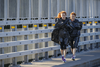 Triathlon Canada hall of fame twins Patricia, front, and Sylviane Puntous warm up before the start of the Rock 'N' Roll Montreal Marathon over the Jacques-Cartier bridge on Sunday, September 25, 2016.