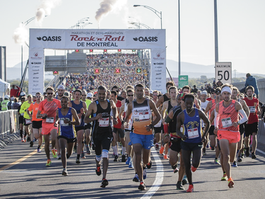 Runners in the first wave of starts begin the Rock 'N' Roll Montreal Marathon over the Jacques-Cartier Bridge on Sunday, September 25, 2016.