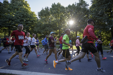Participants run through Jean-Drapeau park as they take part in the Rock 'N' Roll Montreal Marathon on Sunday, September 25, 2016.