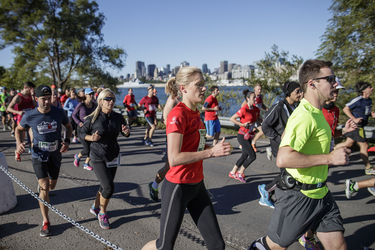 Participants run through Jean-Drapeau park as they take part in the Rock 'N' Roll Montreal Marathon on Sunday, September 25, 2016.