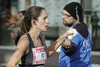 Runner Arianne Raby of Quebec grabs a cup of water as she takes part in the Rock 'N' Roll Montreal in Montreal on Sunday, September 25, 2016. Raby was the winner of the marathon in the women's category.