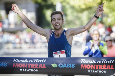 Kari Steinn Karlsson of Iceland arrives at the finish line at Lafontaine Park to win the Rock 'N' Roll Marathon with a time of 2:24:18.6 in Montreal on Sunday, September 25, 2016.