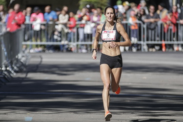 Arianne Raby of Quebec arrives at the finish line at Lafontaine Park to win the Rock 'N' Roll Montreal Marathon with a time of 2:48:55 on Sunday, September 25, 2016.