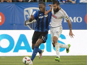 Montreal Impact's Didier Drogba, left, challenges Philadelphia Union's Richard Marquez during first half MLS soccer action in Montreal, Saturday, July 23, 2016.