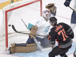 Team North America's Dylan Larkin (71) scores the second goal against Team Europe goaltender Thomas Greiss (1) during first period pre-tournament World Cup of Hockey action Sunday, September 11, 2016 in Montreal.