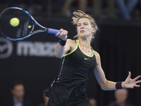 Eugenie Bouchard of Canada returns to Mandy Minella of Luxembourg during first round tennis action at the WTA National Bank Cup, Wednesday, September 14, 2016 in Quebec City.