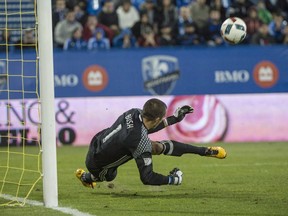 Montreal Impact goalkeeper Evan Bush stops a penalty shot from San Jose Earthquakes forward Chris Wondolowski during second half MLS action Wednesday, September 28, 2016 in Montreal.