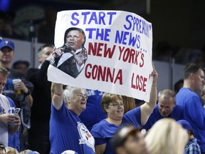 Fans display a sign as the Blue Jays beat the New York Yankees 9-0 in Toronto on Friday, Sept. 23, 2016.