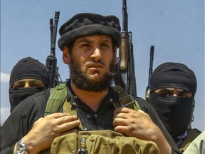 This undated file photo taken from an online edition of the Islamic State's weekly magazine al-Nabaa, allegedly shows Abu Mohamed Al-Adnani, the then spokesman for the Islamic State of Iraq and the Levant (ISIL) group and its commander for Syria. The Pentagon says he was killed in a drone strike.