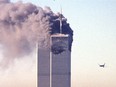 (FILES) This file photo taken on September 11, 2001 shows a hijacked commercial plane approaching the World Trade Center shortly before crashing into the landmark skyscraper in New York.   The Twin Towers collapsed later on that day. September 11, 2016 marks the fifteenth anniversary of the event. /