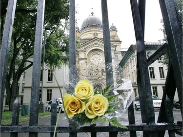 Flowers hang in the gate to the Sherbrooke street entrance to Dawson College, Sept. 14, 2006, one day after the fatal shooting that killed Anastasia De Sousa.