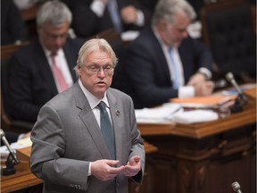Quebec Health Minister Gaetan Barrette responds to the Opposition during question period Tuesday, April 26, 2016 at the legislature in Quebec City.