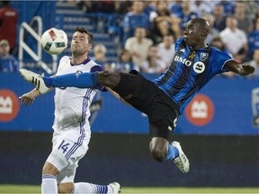 "We have to learn from our mistakes and be sure not to make them in the playoffs," says Montreal Impact defender Hassoun Camara, kicking the ball away from Orlando City FC defender Luke Boden during first half MLS action Wednesday, September 7, 2016 in Montreal. The slumping Impact hope a win over the San Jose Earthquakes will quell comparisons to 2013.