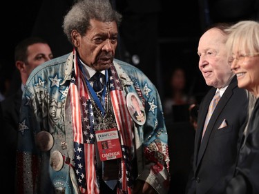 Boxing promoter Don King (L) talks with businessman Sheldon Adelson and his wife Miriam Ochsorn, attend the Presidential Debate between Democratic presidential nominee Hillary Clinton and Republican presidential nominee Donald Trump at Hofstra University on September 26, 2016 in Hempstead, New York.
