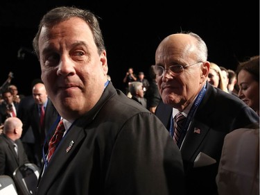 Former New York City Mayor Rudy Giuliani (R) and New Jersey Gov. Chris Christie attend the Presidential Debate at Hofstra University on September 26, 2016 in Hempstead, New York.