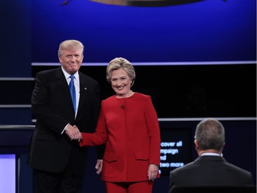 (L-R) Republican presidential nominee Donald Trump and Democratic presidential nominee Hillary Clinton shake hands prior to the start of the Presidential Debate at Hofstra University on September 26, 2016 in Hempstead, New York.