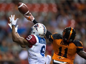 B.C. Lions' Mike Edem, right, breaks up a pass intended for Montreal Alouettes' Kenny Stafford in the end zone during the first half in Vancouver on Friday, Sept/ 9, 2016.