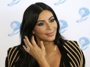 American television personality Kim Kardashian poses for photographers as she attends the Cannes Lions 2015 in Cannes, southern France. The Food and Drug Administration said Kardashian's social media posts promoting Diclegis, an prescription anti-morning sickness drug, violate federal drug promotion rules because they don't mention potentially dangerous side effects and drug interactions.