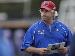 Alouettes head coach and general manager Jim Popp keeps an eye on his players during training camp at Bishop's University in Lennoxville on May 29, 2016.