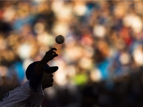 Toronto Blue Jays' Marcus Stroman is silhouetted as he works the New York Yankees during sixth inning MLB baseball action, in Toronto on Saturday, Sept. 24, 2016.