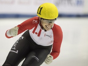 Marianne St-Gelais celebrates after winning the women's 500-metre final race at the ISU World Cup short-track speedskating competition in Montreal, Sunday, Nov. 1, 2015.