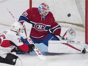 Ottawa Senators' Matt Puempel (26) scores against Montreal Canadiens goaltender Mike Condon during first period NHL pre-season hockey action in Montreal, Thursday, Sept. 29, 2016.